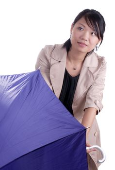 Young asian woman holding umbrella wondering if it will start raining