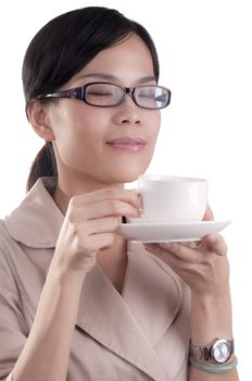 Asian business woman about to enjoy her morning cup of coffee before work isolated