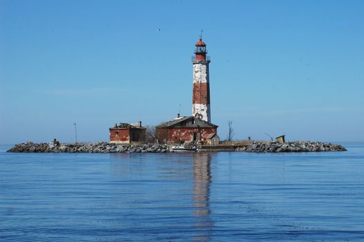 Old beacon. The old beacon on island Suho in Ladoga lake stands alone. Russia.