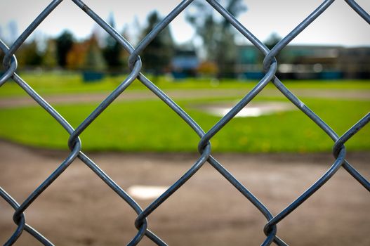 Background of a Baseball Diamond through a chain link fence