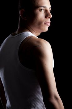 A good looking, muscular built, man on a black background.