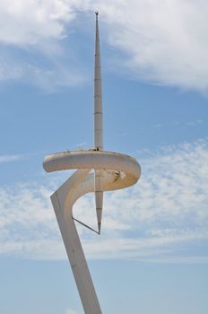 Communication Tower in Barcelona Spain with Blue Sky Background