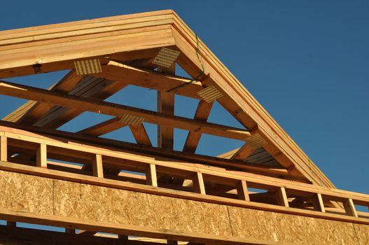 Construction of New Roof on Home with Blue Sky