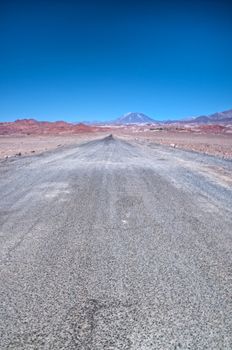 Road Leading towards the mountains in the Atacama Desert, Chile