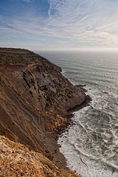 Beautiful cliff over the Atlantic Ocean in region of Sesimbra.