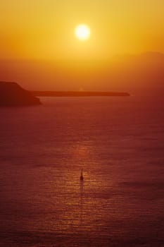 An image of a beautiful sunset over the ocean Santorini