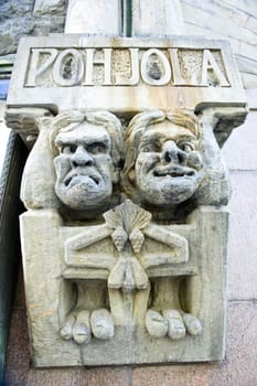 Characters from the Finnish national epos on a building facade in Helsinki.