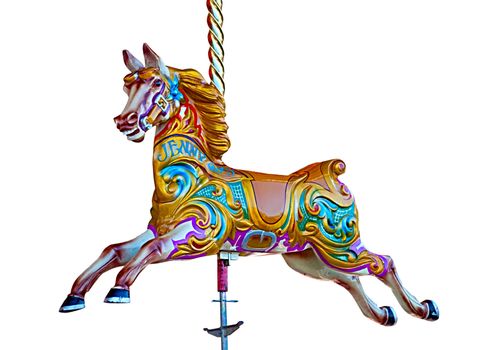 Colorful wooden horses on a carousel ride
