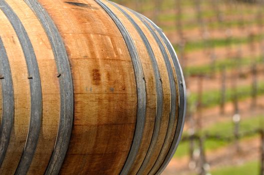 Wine Barrel with Vineyard in Background