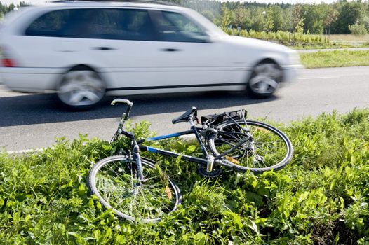 The bicycle lies on a highway roadside.Taken in Finland