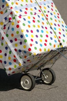 A very big present is transportated on a trolley.