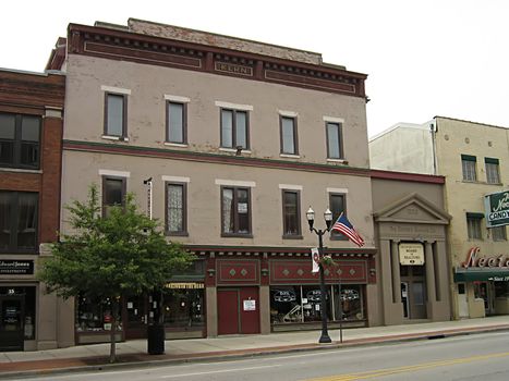 A photograph of commercial buildings in a town.