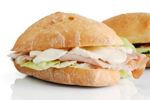 loaf of bread with jam, speck mozzarella and lettuce isolated on white background