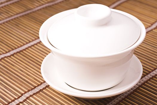 white teacup on wooden table for texture