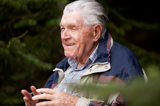 A grandfather telling a story in the forest