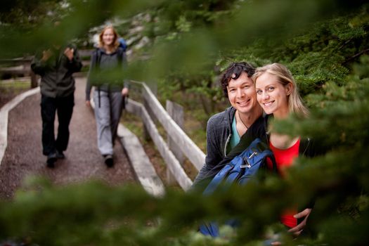 A happy couple on a forest trail