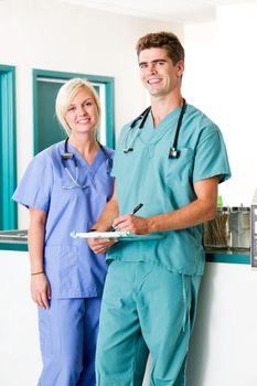 A portrait of a veterinarian and  assistant in a small animal clinic