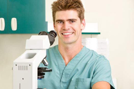 A doctor looking through a microscope