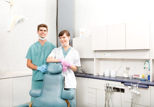 A portrait of a dental team in a clinic smiling at the camera 