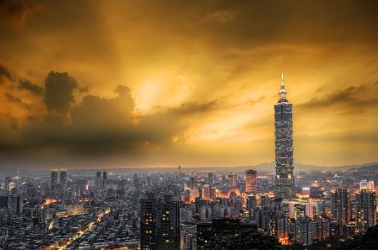 City skyline with dramatic sky and famous skyscraper and buildings in Taipei, Taiwan.