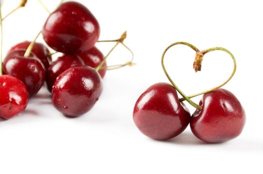 Shot of cherry berry with heart symbol