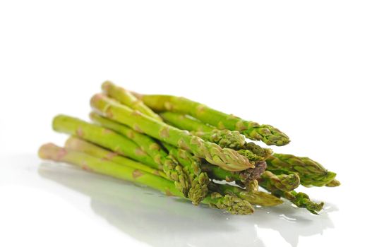 Fresh raw asparagus shot on a white background.