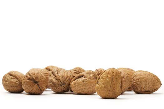 a lot of walnuts on white background
