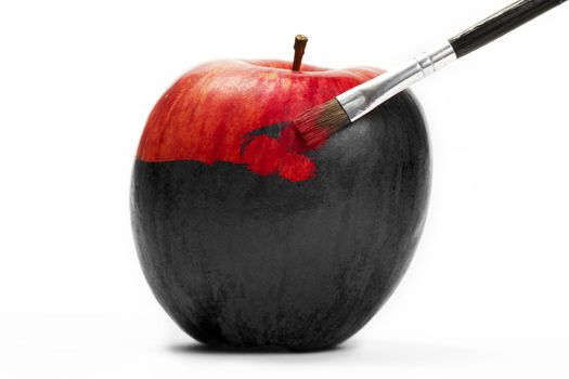 a red apple gets his color with a brush on white background