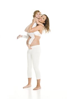 Pregnant woman with her daughter isolated on white background