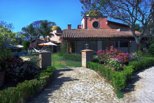 Luxury hotel with garden full of trees and flowers