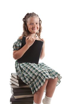 Little girl sitting on stacked books, isolated on white background 