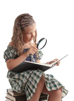 Little girl holding magnifying glass, isolated on white background  