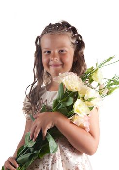 Smiling little girl with pigtail hairstyle holding flowers, isolated on white background 