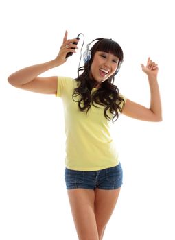 A vivacious active young woman dancing and listening to music