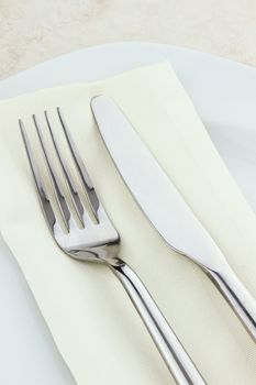 Place setting silverware and napkin. 