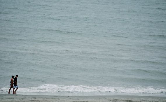 Couple walks along Myrtle Beach