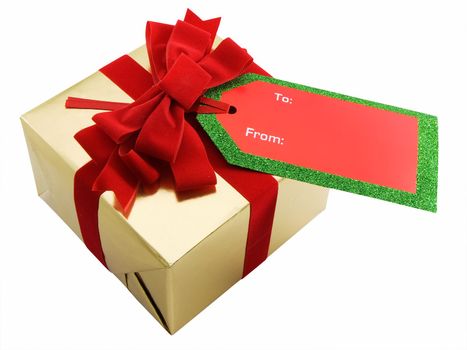 Christmas present with a red bow and gift tag, isolated on white