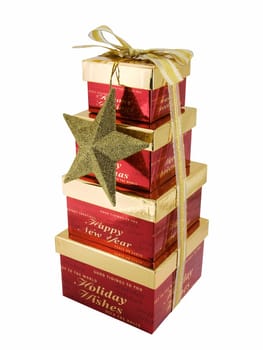 Christmas gift boxes stacked and tied with a ribbon, isolated on a white background