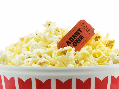 Bucket of popcorn with a admit one movie ticket, isolated on white