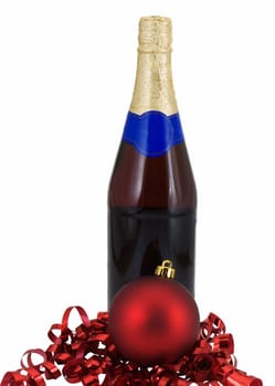 Christmas ornament and curled ribbon with a bottle on wine, isolated on white