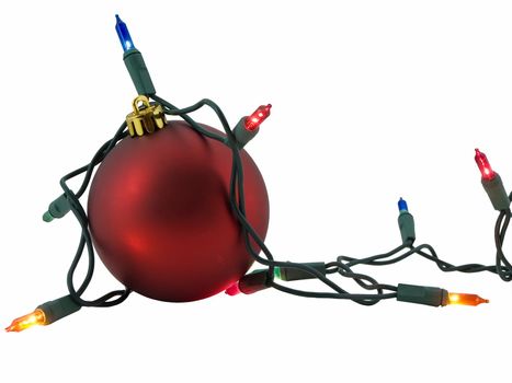 Red christmas ornament with a string of lights surrounding it, isolated on white