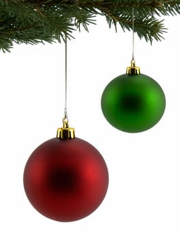 Red and green christmas ornaments hanging from tree, isolated on white