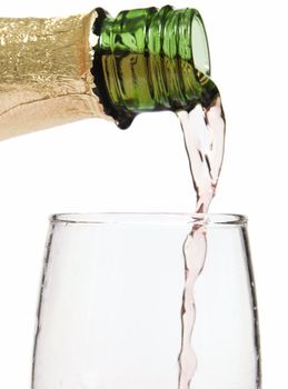 Glass of wine / champagne being poured with a white background