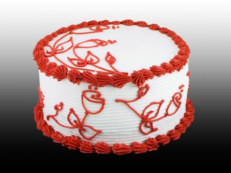 White cake with red frosted flowers on it