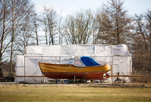 A traditional norwegian boat in the harbour for repairs.