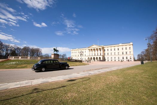 The Oslo Palace on a bright blue day waiting the arrival of a V.I.P.