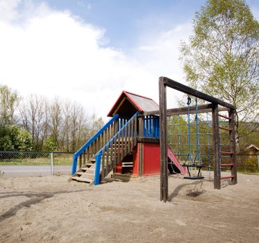 A typical playground with sand on the ground