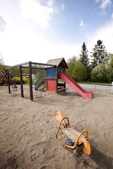 A typical playground with sand on the ground