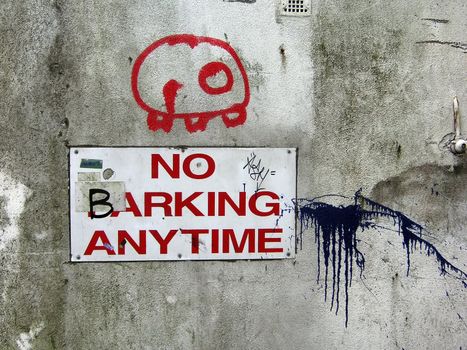 Sign saying 'No barking anytime'
