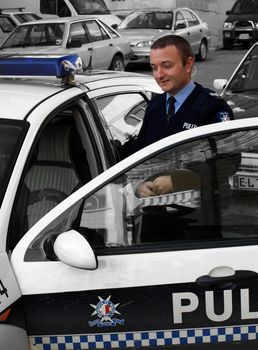 Police sergeant near squad car of the Mobile Squad - Malta Police Force      